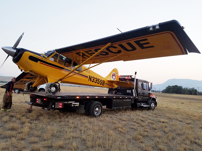 airplane on tow truck wyoming